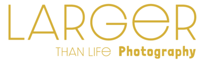 The Larger than Life Photography Logo this version is gold in modern type face.