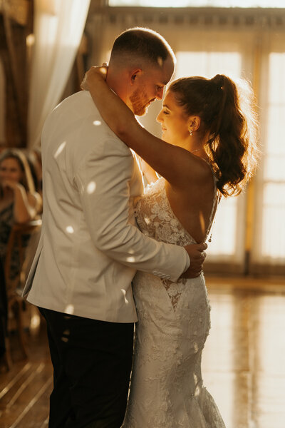 Groom opening his arms wide as his bride is running towards him to embrace him