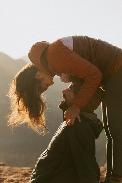a couple as seen from the side looking at each other 