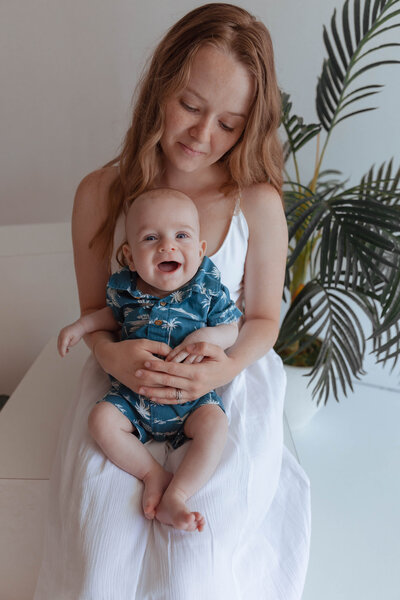 Casual family portrait on the floor with studio props and soft textures