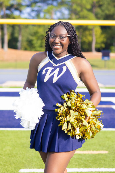 Outdoor senior photo of Atlanta grad with mountain view backdrop