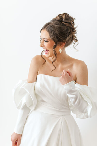 bride laughing in wedding dress