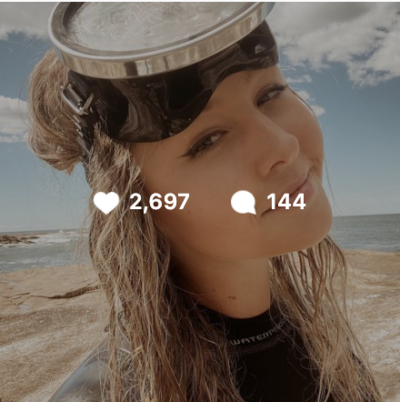 Smiling blonde scuba girl instagram post with over 2600 likes