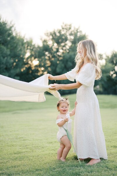 A beautiful moment captured of a mom and her little girl snuggled up during a Dallas family photography session.