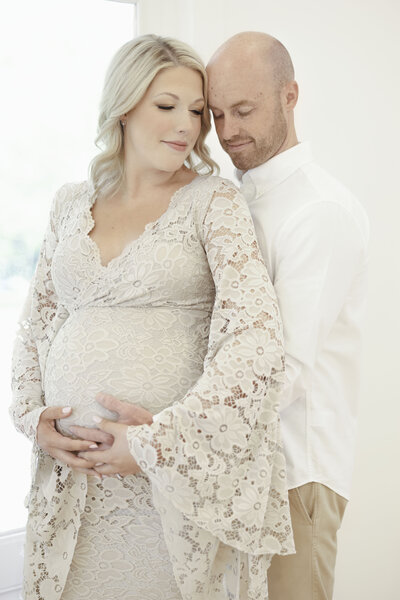in studio Asheville Maternity Photo Session mother and father