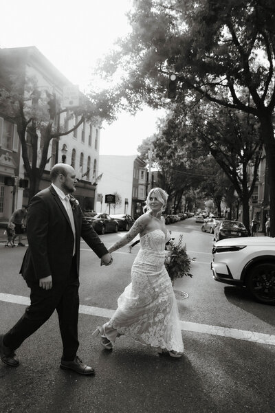 bride and groom wedding dress with bridal bouquet in downtown frederick at tenth ward distillery wedding venue