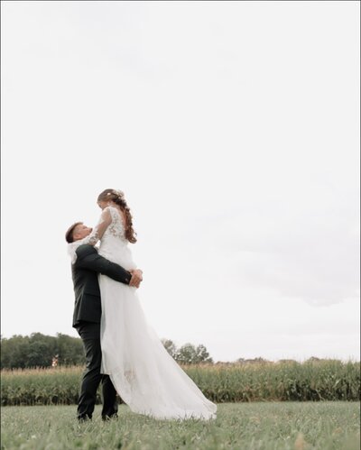 Couple spins in a field after getting married
