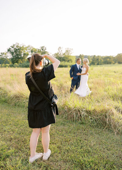 Emma photographing a bride and groom in Huntsville AL