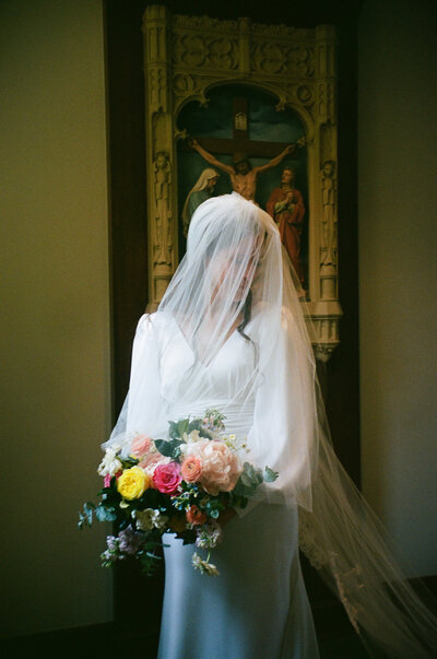 bride and groom sitting together during Catholic wedding ceremony