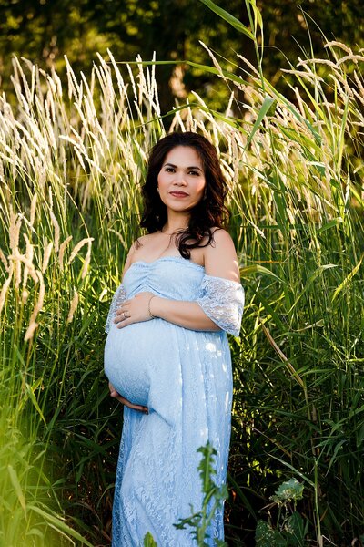 An overhead maternity pose, beautiful black maternity gown.