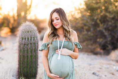 Scottsdale maternity photo of mom holding baby bump