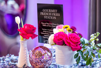 Corporate event in DC with gourmet french fries station, a disco ball and flowers