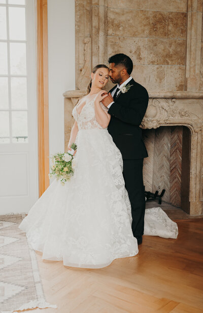 Couple holding hands and bride with bouquet