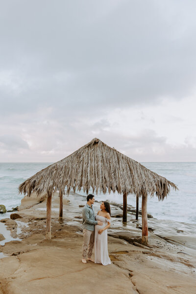 Natural Candid Documentary Family Maternity Baby Pregnancy Announcement Photo shoot at La Jolla Windansea beach at sunset - Couples Mom and Dad San Diego Maternity Photographer
