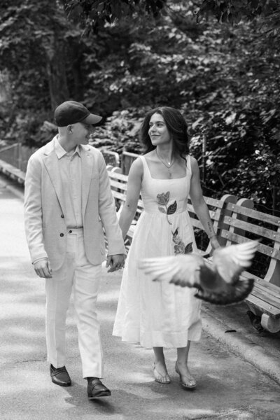 Bird flies in front of couple in upper East side elopement photograph. 