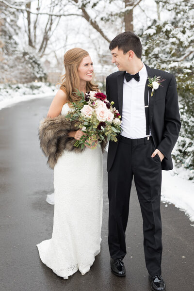 Bride and groom on snowy path
