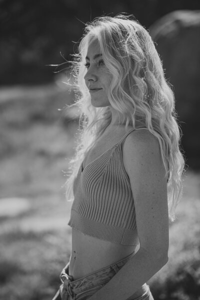 woman standing in a field looking away