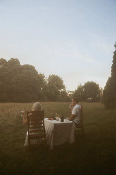 couple touching glasses of champagne