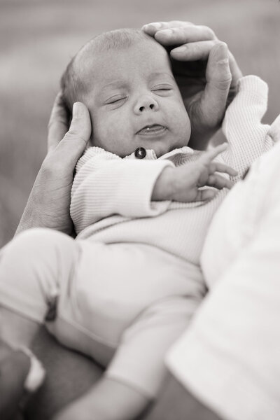 Precious moment of a newborn baby in the arms of his father. 