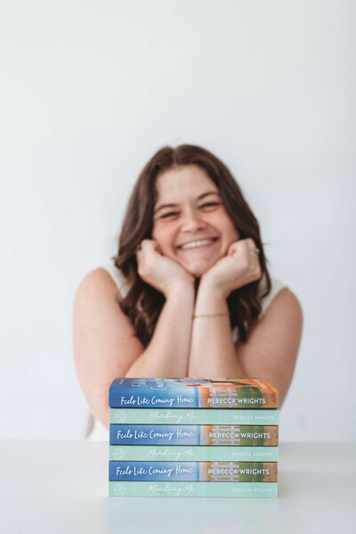 Woman smiling with her head in her hands