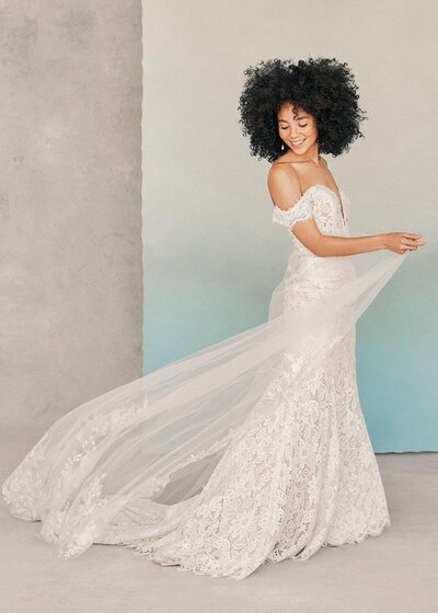 This gown's modified A-line silhouette accents curves while maintaining a full-skirted silhouette.