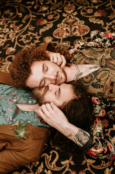queer couple embracing  each other boho engagement shoot