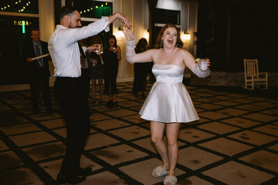 Bride showing off reception dress change at The Bradford