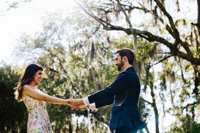 Queer Couple laughing in Wynwood during Engagement Photo Session