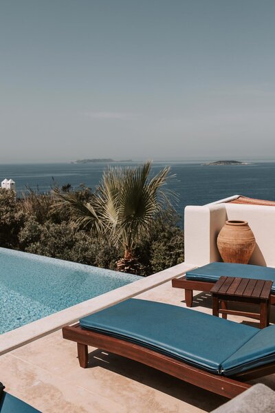 sun loungers in front of pool, concierge travel