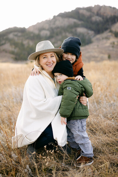 A family poses together for a beautiful portrait during their family session in Fort Collins, Colorado.