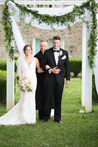 Stone-Manor-Country-Club-MD-wedding-florist-ceremony-arch-garland-Lauren-Daue-Photography