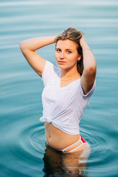 Montana woman posing in swimsuit in Foys Lake, Kalispell