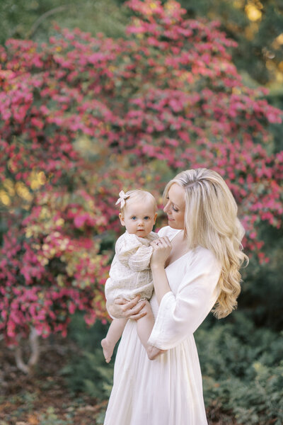 stockton family photography session motherhood in front of pink flowers