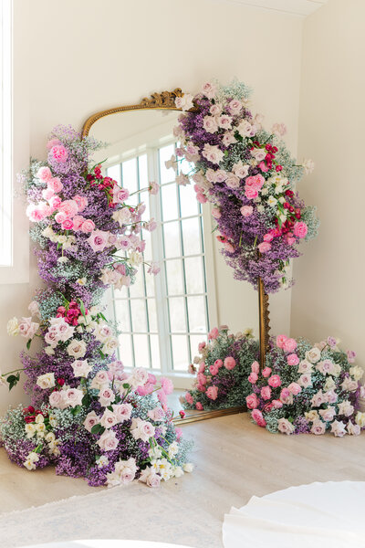 large mirror decorated with florals st. louis wedding photographer