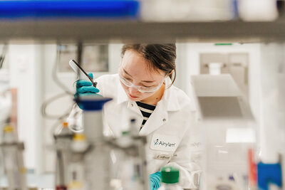 female in stem works in lab during boston photoshoot