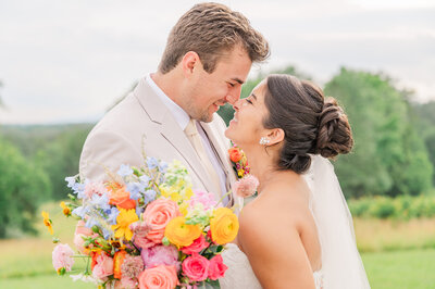 A redheaded bride holding hands with her new husband at The Prestonwood Country Club in the fall enjoying their destination wedding photos by JoLynn Photography