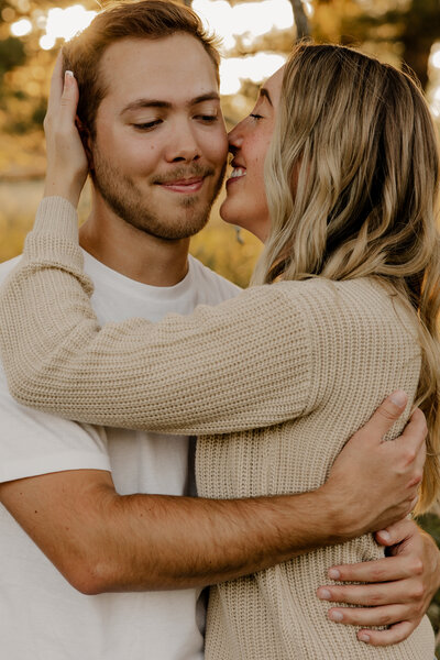 Romantic Omaha engagement session during the fall, captured by Tori Nichole Photography. The couple is surrounded by vibrant autumn foliage and golden light, creating warm, timeless moments. A perfect blend of natural beauty and authentic connection, showcasing the magic of the season and their love story.