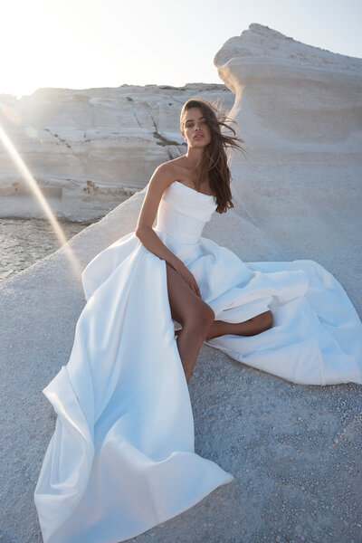 Be followed by a train of lustrous duchess satin every step you take with the KYHA BRIDE 'Milford' Skirt.

With a fitted waistband and full pleated skirt with a modern split, the Milford Skirt can be styled as an overskirt to raise the drama of any look or with the Kasia Corset to upgrade to a modern ballgown.