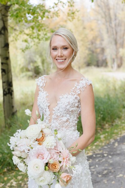 Jackson Hole bride smiling at the camera