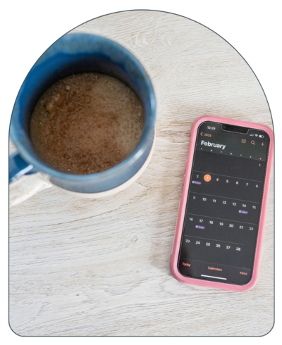 Coffee Mug with Phone on Calendar