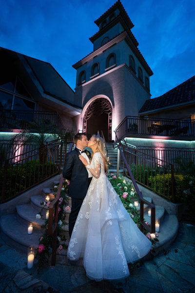 Couple kissing at night at their wedding at South Coast Winery Wedding venue in Temecula