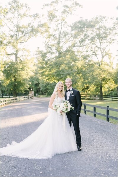 Bride and groom walk outdoors at their wedding at the Oak Atelier