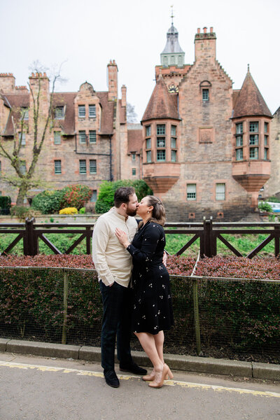 Edinburgh Engagement couple kiss in Dean Village, photo by love is magic photography