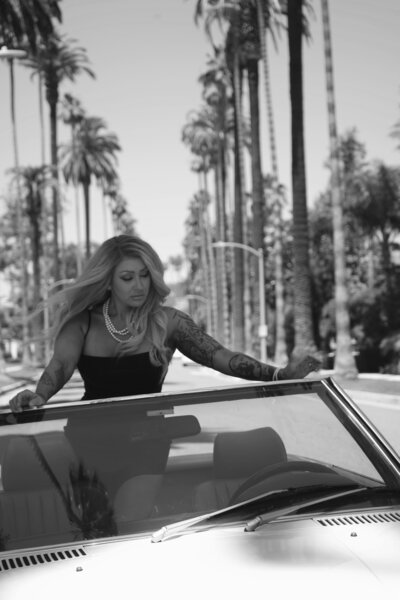 Nicky Lynn in a sun-drenched setting, holding space for transformation through trauma therapy