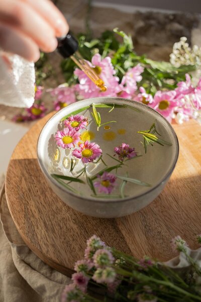 Bowl of flowers on a wooden table