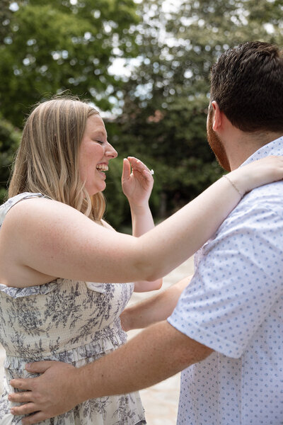 Couple smiles together as they have recently gotten engaged at Bell Meade Historic Winery in Nashville, TN.