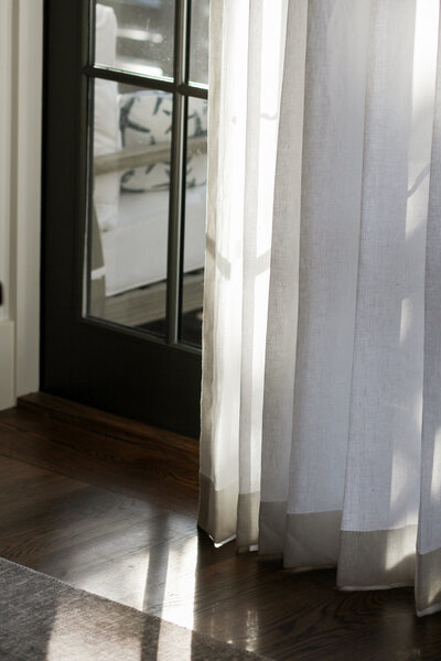 Linen curtains and stained oak floors