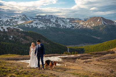Bride and Groom laugh at a joke the groom made at the overlook to an alpine lake.