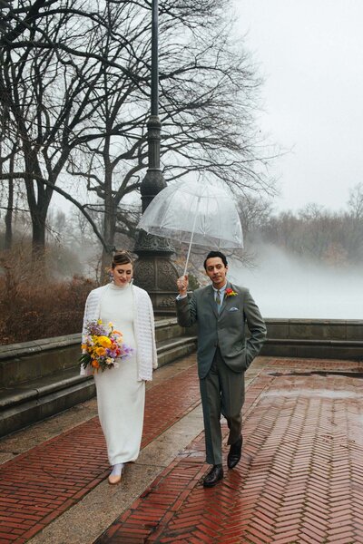 winter central park elopement with happy isles vintage dress at bethesda fountain terrace