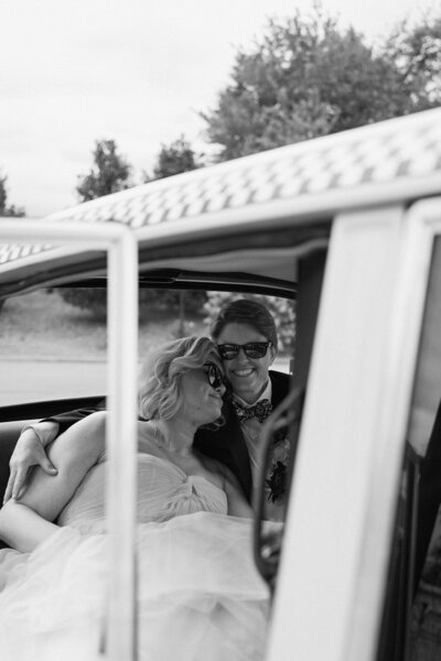 couple cuddling in a taxi